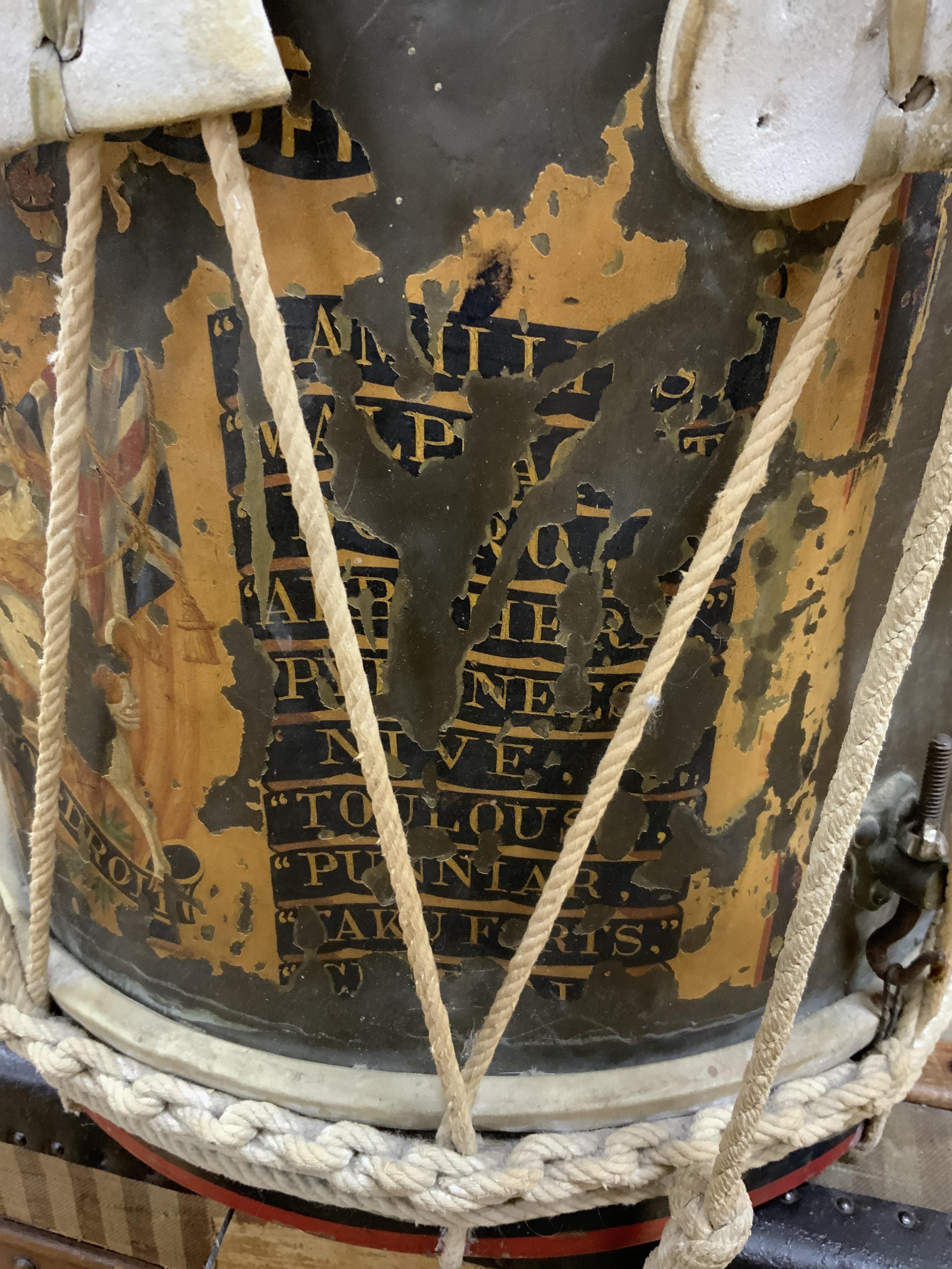 A late 19th/early 20th century Royal East Kent Regiment 'Buffs' regimental drum, 37cm diameter, 37cm high, together with a rope edged, stained pine removable 'table top' adaption